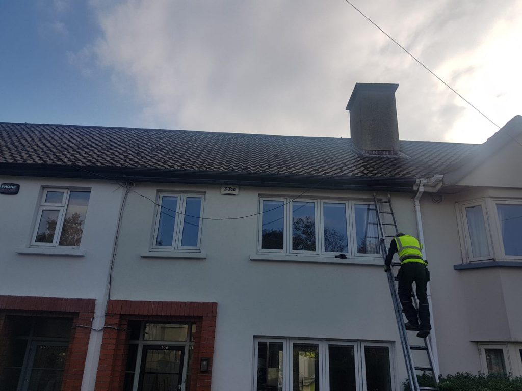 Team member doing gutter repairs