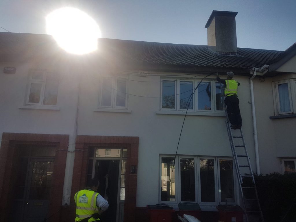 Team member doing gutter repairs